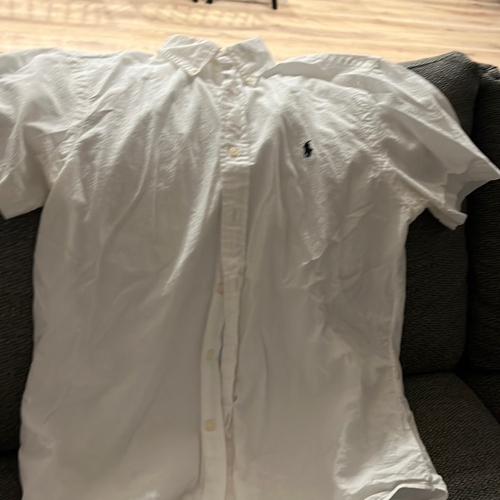 White nice Ralph Lauren polo. Never worn. Too small for husband